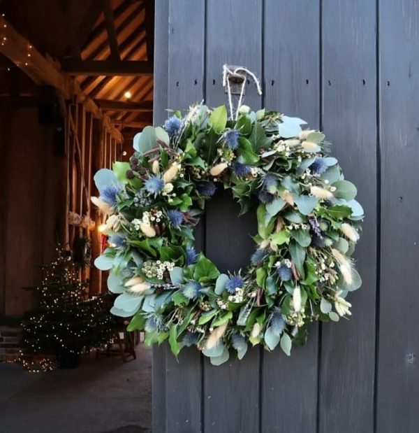 Christmas Wreath hanging on a barn door
